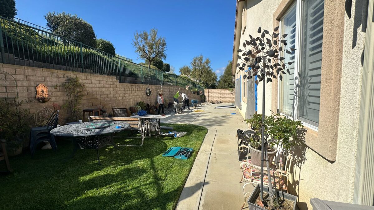 Complete Backyard Remodel in Simi Valley, CA – Pavers, Grass, Planter Wall & Lighting At Green Advisor Inc., we believe a backyard should be more than just an outdoor area—it should be a place where comfort, function, and beauty come together. Our latest project on Pine View Dr in Simi Valley, CA is a perfect example of how a complete backyard remodel can transform a space into a modern, inviting, and low-maintenance outdoor retreat. Project Overview This backyard renovation was designed to improve both style and functionality while keeping maintenance simple for the homeowners. The scope of work included: Paver installation for a clean, durable, and elegant surface. New grass installation supported by a modern irrigation system. Custom raised planter wall for added design and planting space. Low-voltage lighting system to highlight features and improve evening use. The Remodeling Process 1. Site Preparation & Demolition The project began with clearing the old, uneven surfaces and preparing the ground for new construction. Proper grading was carried out to ensure water drained effectively and to create a solid base for the new pavers and grass. 2. Paver Installation We installed high-quality pavers to create a functional and visually appealing surface. Pavers were carefully selected to complement the home’s exterior and provide long-lasting durability. This surface now serves as the perfect foundation for outdoor gatherings, seating, and walkways. 3. New Grass & Irrigation System To bring vibrancy back to the backyard, we installed fresh sod and paired it with a fully automated irrigation system. This system ensures that the lawn stays green and healthy year-round while conserving water—a must in Southern California’s climate. 4. Raised Planter Wall A custom raised planter wall was constructed to add depth and dimension to the space. This feature not only gives the backyard structure but also provides the perfect area for plants, flowers, and shrubs, making the landscape more dynamic and inviting. 5. Low-Voltage Lighting System To complete the project, we installed a low-voltage lighting system throughout the backyard. These lights provide subtle illumination, improve safety at night, and highlight key landscape features. The lighting also extends the usability of the space well into the evening, creating a cozy ambiance. Before & After Transformation Before the remodel, the backyard lacked organization and visual appeal. The surfaces were worn, the grass struggled to thrive, and the overall layout did not make the most of the available space. After our work, the transformation was undeniable: A smooth, polished paver surface replaced the old ground. A vibrant green lawn brought life back to the yard. The raised planter wall added dimension and beauty. Strategic lighting tied everything together, making the backyard welcoming both day and night. The result is a backyard that is both practical and stunning—a true outdoor extension of the home. Why This Backyard Remodel Stands Out What makes this project special is the combination of hardscaping, landscaping, and modern lighting in one cohesive design. Every detail was thoughtfully planned and executed, ensuring that the homeowners now have a backyard that’s as functional as it is beautiful. This remodel demonstrates how the right mix of pavers, irrigation, raised planter walls, and low-voltage lighting can completely redefine outdoor living. Work with Green Advisor Inc. At Green Advisor Inc., we specialize in creating custom backyard solutions across Los Angeles and Ventura County, including Simi Valley, Woodland Hills, and surrounding areas. Whether it’s paver installation, irrigation systems, planter walls, or outdoor lighting, our team delivers quality and style that last. If you’re ready to transform your outdoor space, contact us today to schedule your free consultation. 📍 Location of Project: Pine View Dr, Simi Valley, CA 93065 📞 Contact Green Advisor Inc.: Los Angeles Office – (888) 869-0987 Encino Office – (818) 290-3926 🌐 Visit our portfolio for more projects
