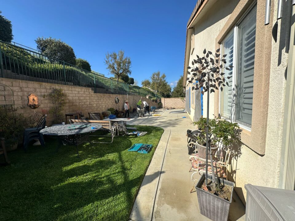 Complete Backyard Remodel in Simi Valley, CA – Pavers, Grass, Planter Wall & Lighting At Green Advisor Inc., we believe a backyard should be more than just an outdoor area—it should be a place where comfort, function, and beauty come together. Our latest project on Pine View Dr in Simi Valley, CA is a perfect example of how a complete backyard remodel can transform a space into a modern, inviting, and low-maintenance outdoor retreat. Project Overview This backyard renovation was designed to improve both style and functionality while keeping maintenance simple for the homeowners. The scope of work included: Paver installation for a clean, durable, and elegant surface. New grass installation supported by a modern irrigation system. Custom raised planter wall for added design and planting space. Low-voltage lighting system to highlight features and improve evening use. The Remodeling Process 1. Site Preparation & Demolition The project began with clearing the old, uneven surfaces and preparing the ground for new construction. Proper grading was carried out to ensure water drained effectively and to create a solid base for the new pavers and grass. 2. Paver Installation We installed high-quality pavers to create a functional and visually appealing surface. Pavers were carefully selected to complement the home’s exterior and provide long-lasting durability. This surface now serves as the perfect foundation for outdoor gatherings, seating, and walkways. 3. New Grass & Irrigation System To bring vibrancy back to the backyard, we installed fresh sod and paired it with a fully automated irrigation system. This system ensures that the lawn stays green and healthy year-round while conserving water—a must in Southern California’s climate. 4. Raised Planter Wall A custom raised planter wall was constructed to add depth and dimension to the space. This feature not only gives the backyard structure but also provides the perfect area for plants, flowers, and shrubs, making the landscape more dynamic and inviting. 5. Low-Voltage Lighting System To complete the project, we installed a low-voltage lighting system throughout the backyard. These lights provide subtle illumination, improve safety at night, and highlight key landscape features. The lighting also extends the usability of the space well into the evening, creating a cozy ambiance. Before & After Transformation Before the remodel, the backyard lacked organization and visual appeal. The surfaces were worn, the grass struggled to thrive, and the overall layout did not make the most of the available space. After our work, the transformation was undeniable: A smooth, polished paver surface replaced the old ground. A vibrant green lawn brought life back to the yard. The raised planter wall added dimension and beauty. Strategic lighting tied everything together, making the backyard welcoming both day and night. The result is a backyard that is both practical and stunning—a true outdoor extension of the home. Why This Backyard Remodel Stands Out What makes this project special is the combination of hardscaping, landscaping, and modern lighting in one cohesive design. Every detail was thoughtfully planned and executed, ensuring that the homeowners now have a backyard that’s as functional as it is beautiful. This remodel demonstrates how the right mix of pavers, irrigation, raised planter walls, and low-voltage lighting can completely redefine outdoor living. Work with Green Advisor Inc. At Green Advisor Inc., we specialize in creating custom backyard solutions across Los Angeles and Ventura County, including Simi Valley, Woodland Hills, and surrounding areas. Whether it’s paver installation, irrigation systems, planter walls, or outdoor lighting, our team delivers quality and style that last. If you’re ready to transform your outdoor space, contact us today to schedule your free consultation. 📍 Location of Project: Pine View Dr, Simi Valley, CA 93065 📞 Contact Green Advisor Inc.: Los Angeles Office – (888) 869-0987 Encino Office – (818) 290-3926 🌐 Visit our portfolio for more projects