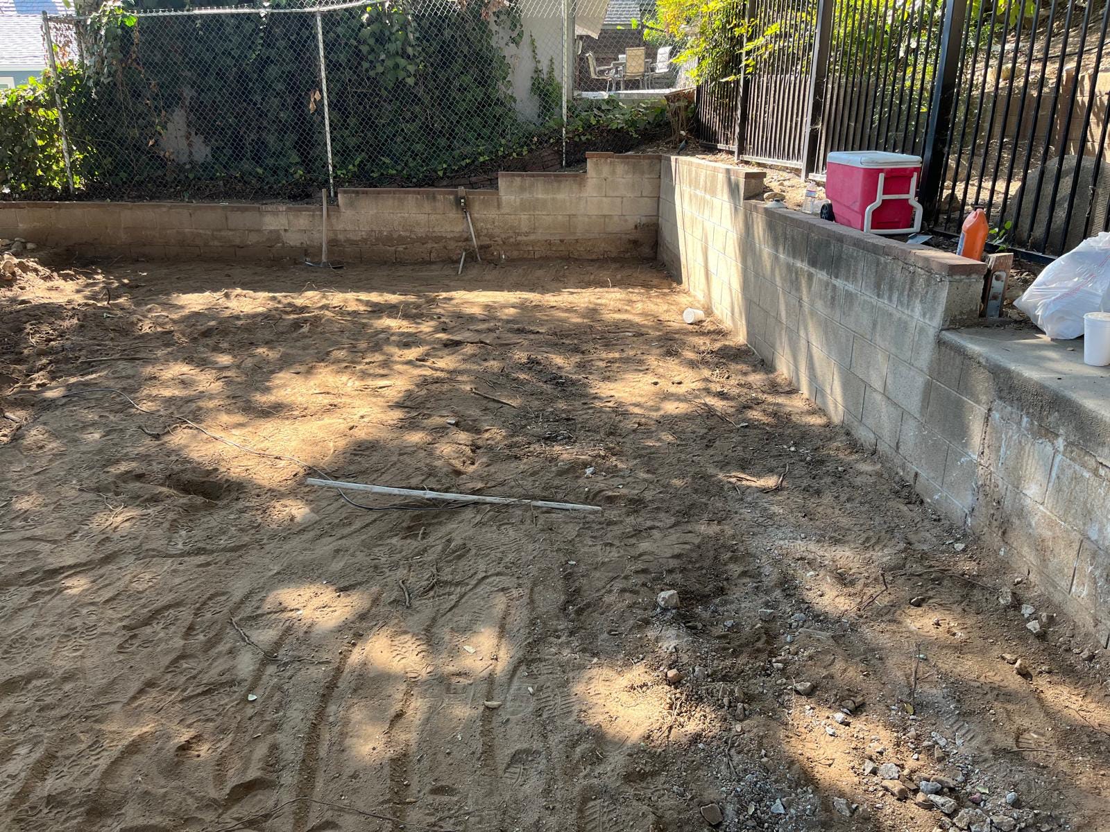 Installing sand bedding for paver alignment