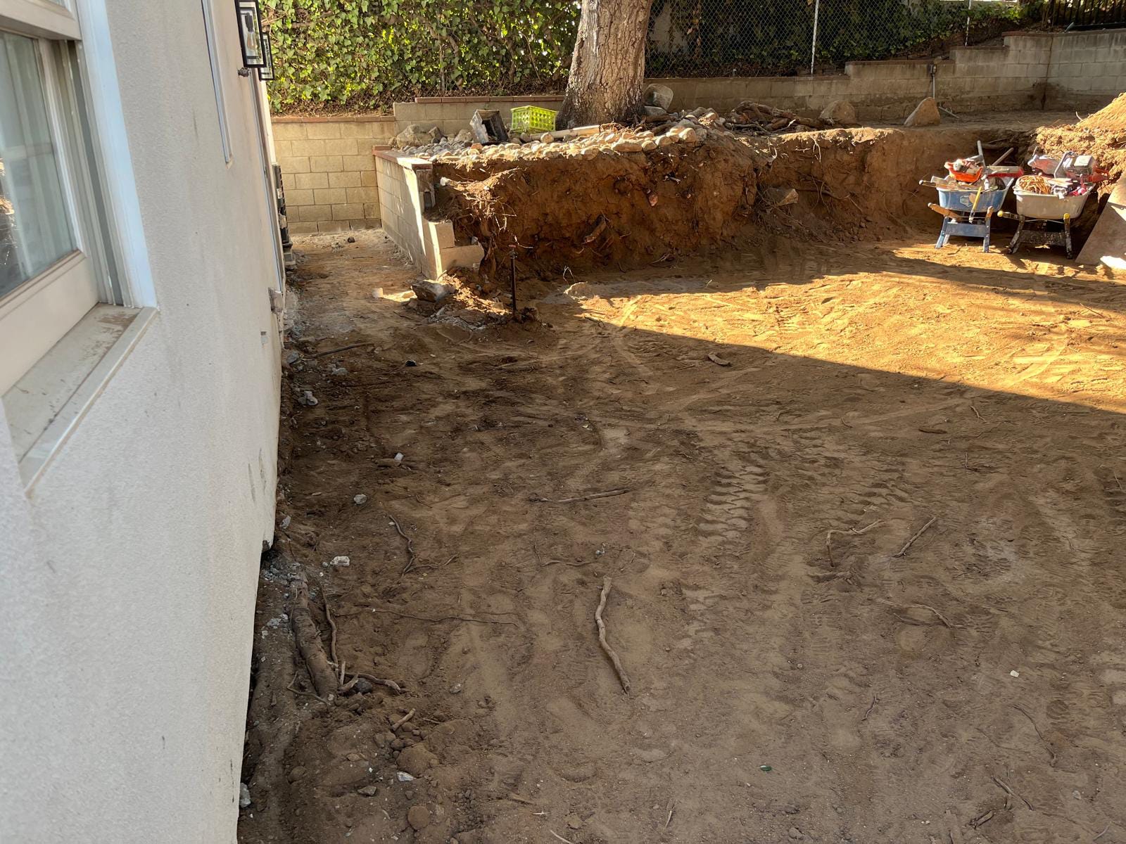 Laying the gravel base for pavers