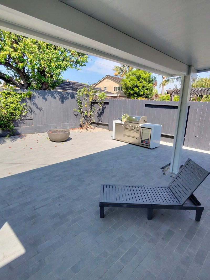 Covered outdoor kitchen with pergola
