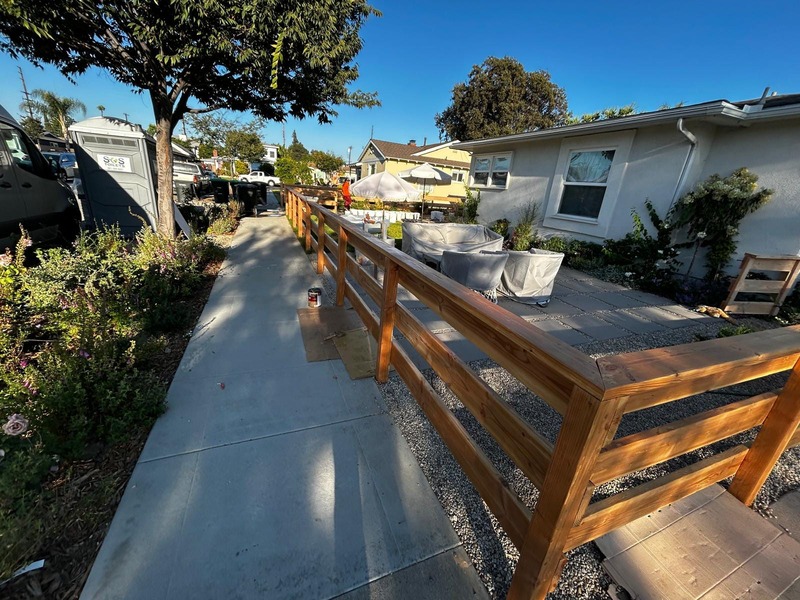 Modern custom wood fence installation along front yard sidewalk in Orange CA backyard and landscape remodel