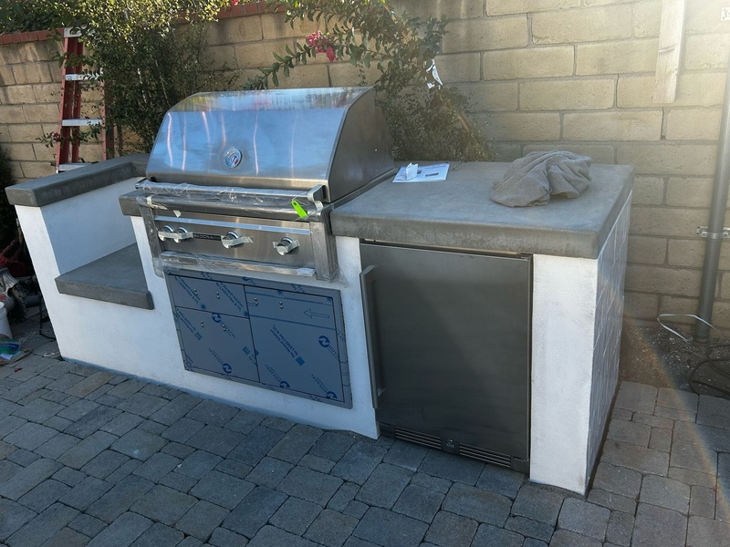 Custom built-in BBQ island with granite countertops