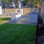Completed backyard remodeling project in Orange, CA with pavers, Trex stairs, custom BBQ, fireplace, turf, fencing, and planters.