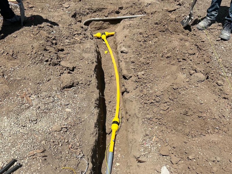 Professional gas line installation for custom outdoor fireplace project in Orange California backyard remodel