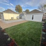 Small backyard remodeling project in Los Angeles with modern lawn landscaping, gravel pathways, paver patio, and low-maintenance outdoor living design.