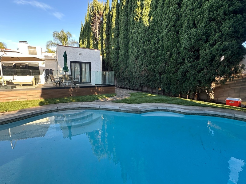 Swimming pool and spa construction with pool deck and outdoor living space during a Los Angeles backyard remodeling project
